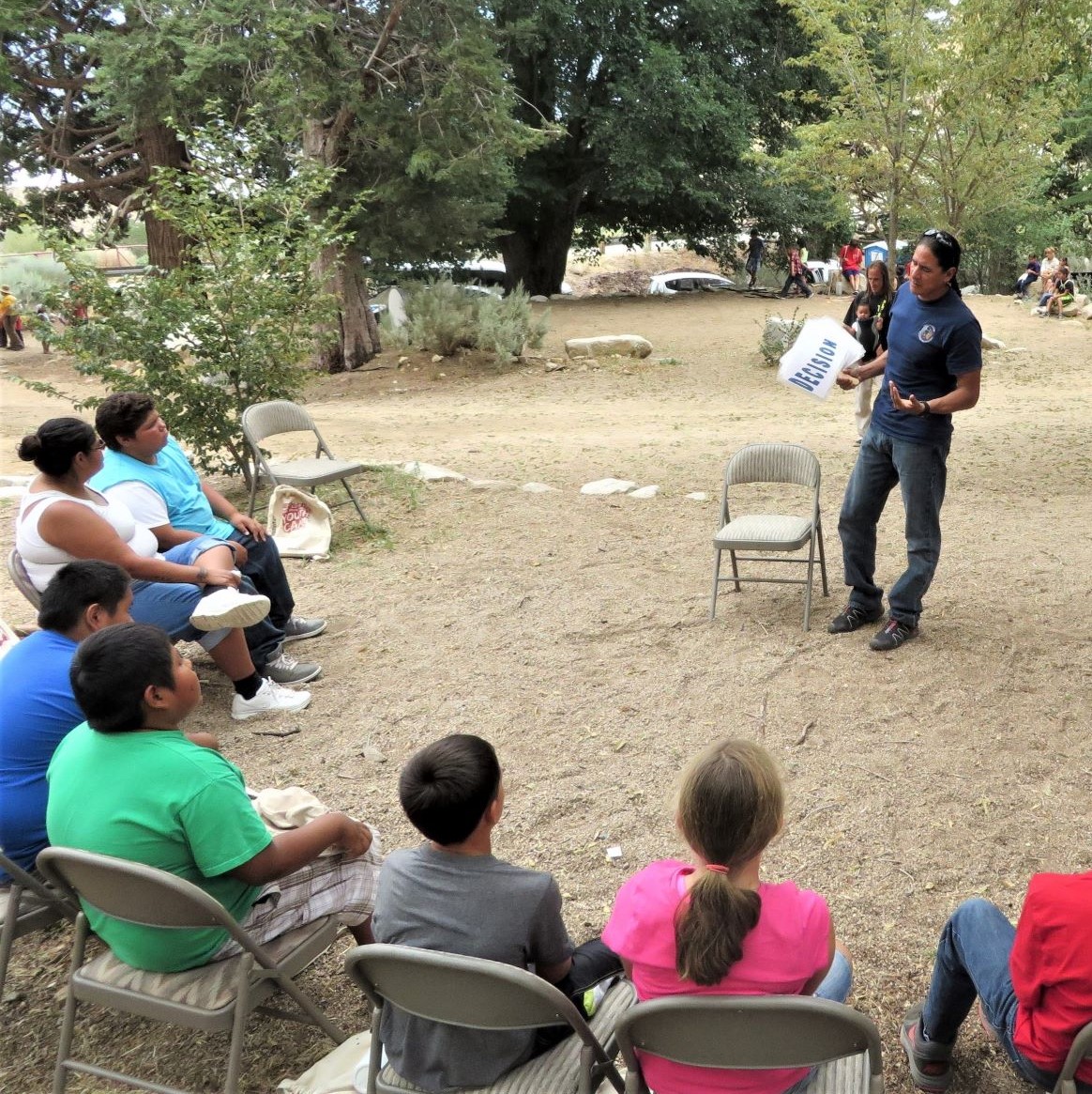 A wildland fire educator gives a presentation on fire prevention.