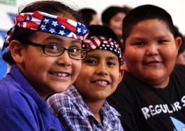 Three Native American youth smiling